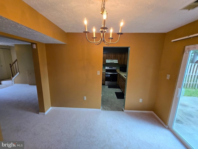 14 Riverside Run Dr, Indian Head, MD 20640 - spare room featuring light carpet, a chandelier, a textured ceiling, and healthy amount of natural light