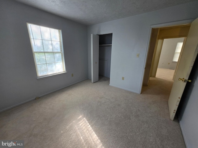 14 Riverside Run Dr, Indian Head, MD 20640 - unfurnished bedroom featuring carpet, a textured ceiling, and a closet