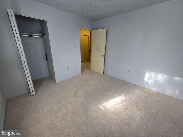 14 Riverside Run Dr, Indian Head, MD 20640 - unfurnished bedroom featuring carpet flooring, a textured ceiling, and a closet