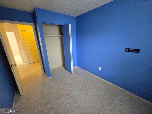14 Riverside Run Dr, Indian Head, MD 20640 - unfurnished bedroom featuring carpet flooring, a closet, and a textured ceiling