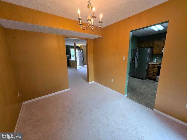 14 Riverside Run Dr, Indian Head, MD 20640 - carpeted spare room featuring a chandelier and a textured ceiling