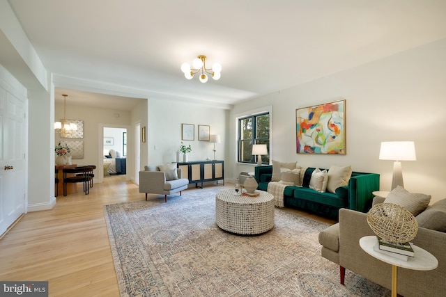 3100 Connecticut Ave NW Unit 434, Washington, DC 20008 - living room with a chandelier and light wood-style floors