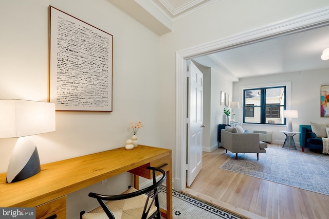 3100 Connecticut Ave NW Unit 434, Washington, DC 20008 - home office with wood finished floors, ornamental molding, and a wall mounted air conditioner