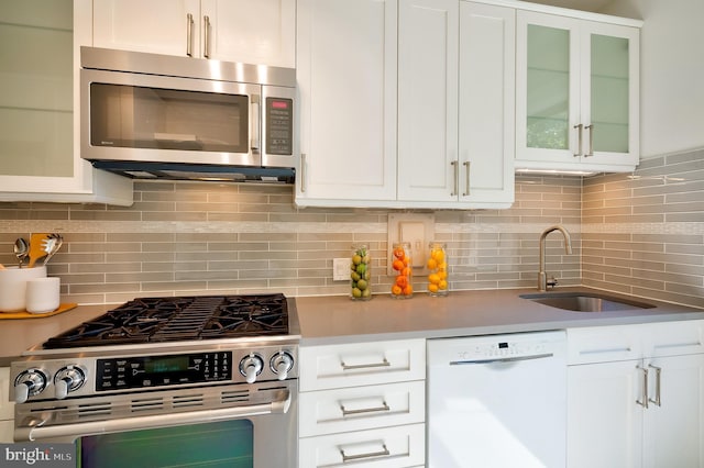 3100 Connecticut Ave NW Unit 434, Washington, DC 20008 - kitchen featuring stainless steel appliances, white cabinetry, and tasteful backsplash