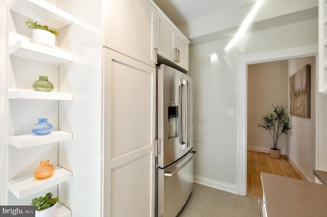 3100 Connecticut Ave NW Unit 434, Washington, DC 20008 - kitchen featuring open shelves, stainless steel refrigerator with ice dispenser, white cabinets, light countertops, and light wood-style floors