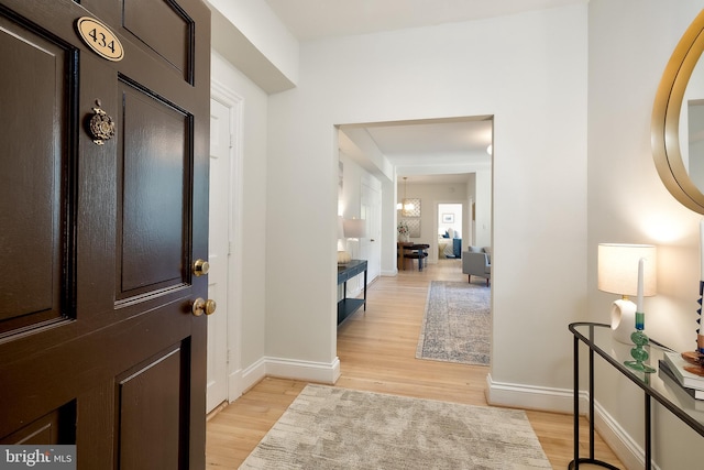 3100 Connecticut Ave NW Unit 434, Washington, DC 20008 - foyer with light wood finished floors and a chandelier