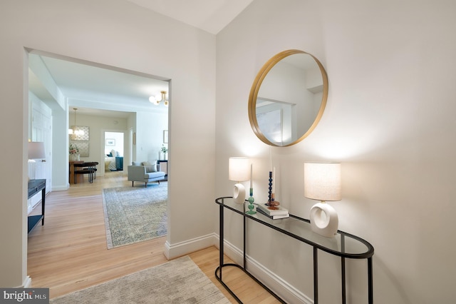 3100 Connecticut Ave NW Unit 434, Washington, DC 20008 - hallway featuring wood finished floors and a chandelier
