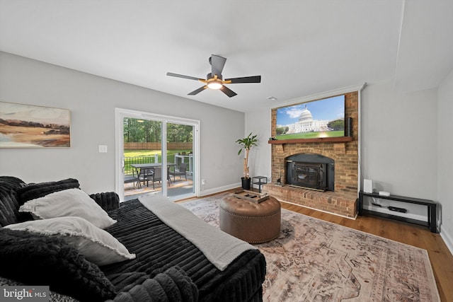 14731 Conway Dr, Manassas, VA 20112 - living room featuring wood finished floors, a ceiling fan, and a wood stove