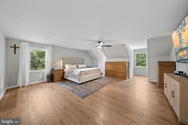 14731 Conway Dr, Manassas, VA 20112 - bedroom featuring multiple windows, light wood-type flooring, a ceiling fan, and lofted ceiling