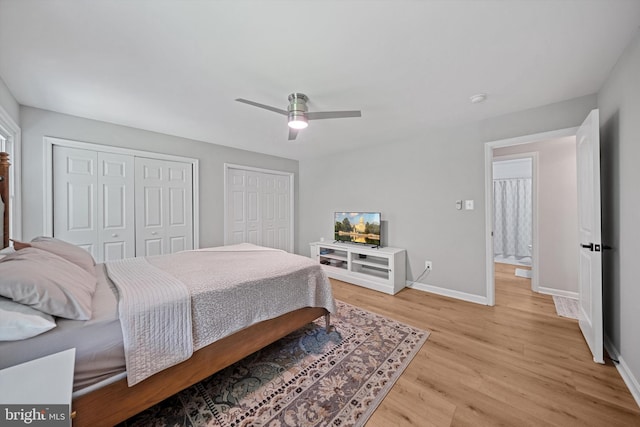 14731 Conway Dr, Manassas, VA 20112 - bedroom featuring multiple closets, light wood-type flooring, and a ceiling fan
