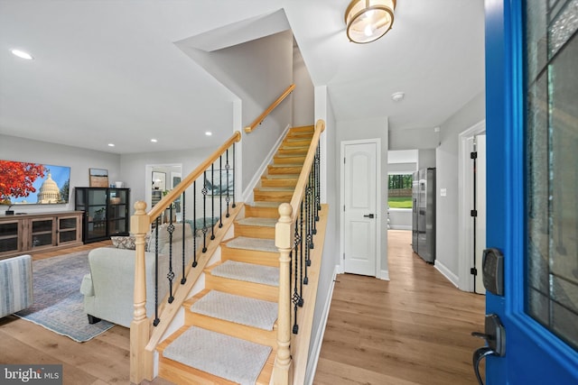 14731 Conway Dr, Manassas, VA 20112 - foyer entrance featuring stairs, wood finished floors, and recessed lighting