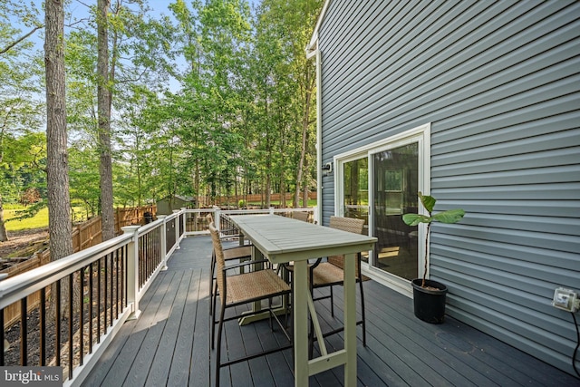 14731 Conway Dr, Manassas, VA 20112 - wooden terrace featuring outdoor dining area and a fenced backyard