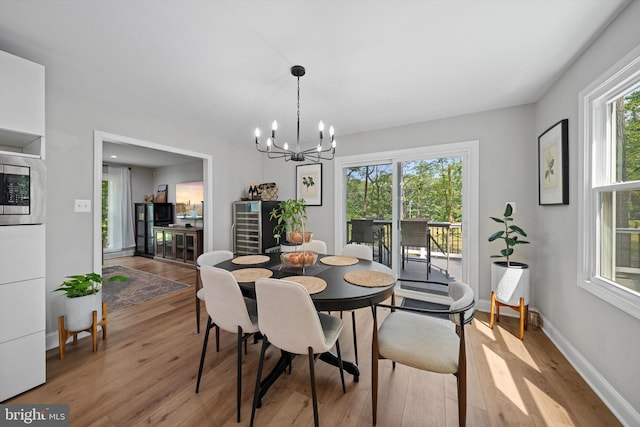 14731 Conway Dr, Manassas, VA 20112 - dining area with light wood-style floors and a chandelier