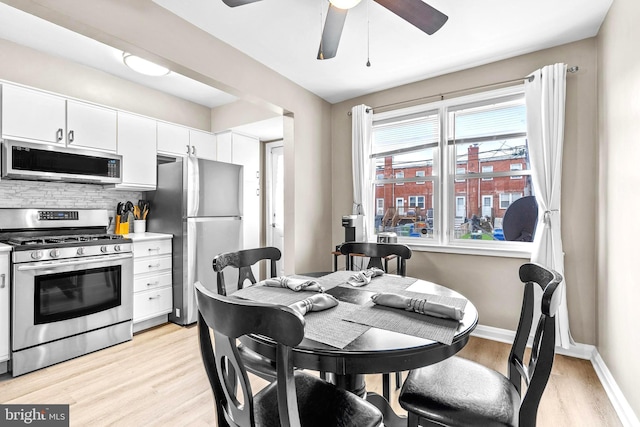 336 Imla St, Baltimore, MD 21224 - dining area with a ceiling fan and light wood-style flooring
