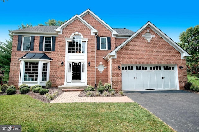 1806 Woodhome Dr, Bel Air, MD 21015 - view of front of house with driveway, brick siding, a front lawn, and an attached garage