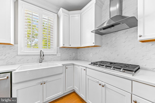 806 Dunfer Hill Rd, Severna Park, MD 21146 - kitchen featuring wall chimney exhaust hood, gas stovetop, white cabinets, and light countertops