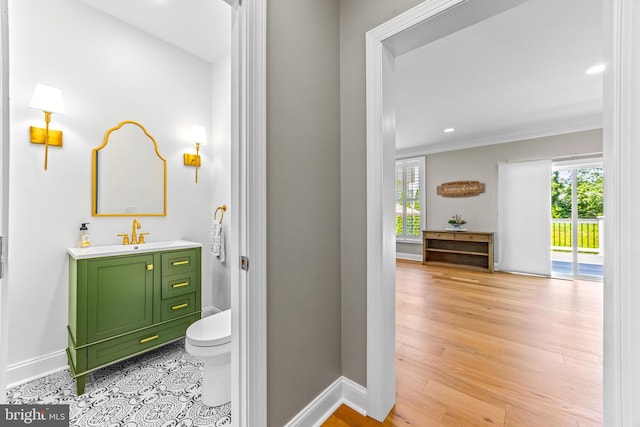 806 Dunfer Hill Rd, Severna Park, MD 21146 - bathroom with vanity, crown molding, wood finished floors, and recessed lighting