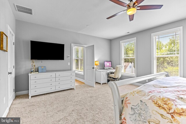 806 Dunfer Hill Rd, Severna Park, MD 21146 - bedroom with light colored carpet, an office area, and a ceiling fan