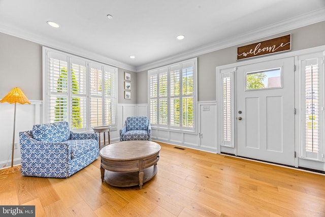 806 Dunfer Hill Rd, Severna Park, MD 21146 - foyer entrance with a decorative wall, a wainscoted wall, ornamental molding, wood finished floors, and recessed lighting
