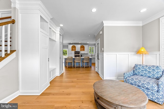806 Dunfer Hill Rd, Severna Park, MD 21146 - corridor with recessed lighting, light wood-style flooring, a wainscoted wall, ornamental molding, and a decorative wall