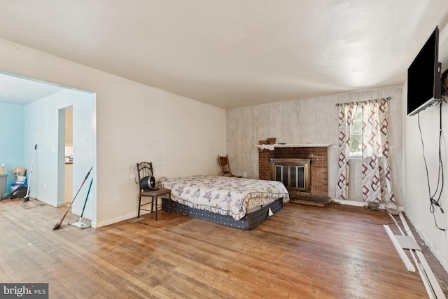 7022 High Bridge Rd, Bowie, MD 20720 - bedroom with wood finished floors and a brick fireplace