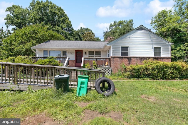 7022 High Bridge Rd, Bowie, MD 20720 - ranch-style home with brick siding, a wooden deck, and a front lawn