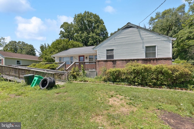 7022 High Bridge Rd, Bowie, MD 20720 - rear view of property with a wooden deck, brick siding, and a yard