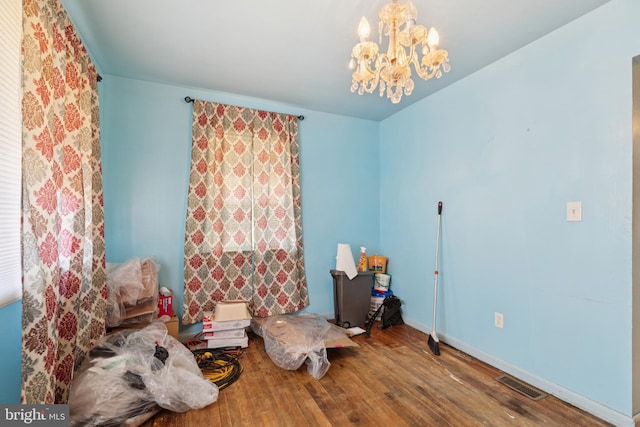 7022 High Bridge Rd, Bowie, MD 20720 - living area with wood finished floors and a chandelier