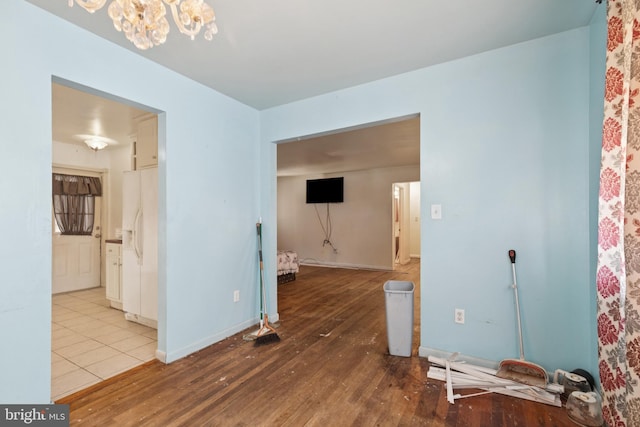 7022 High Bridge Rd, Bowie, MD 20720 - spare room featuring a chandelier and wood-type flooring