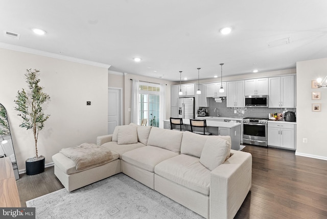 23230 Milltown Knoll Sq Unit 106, Ashburn, VA 20148 - living area featuring crown molding, dark wood finished floors, and recessed lighting