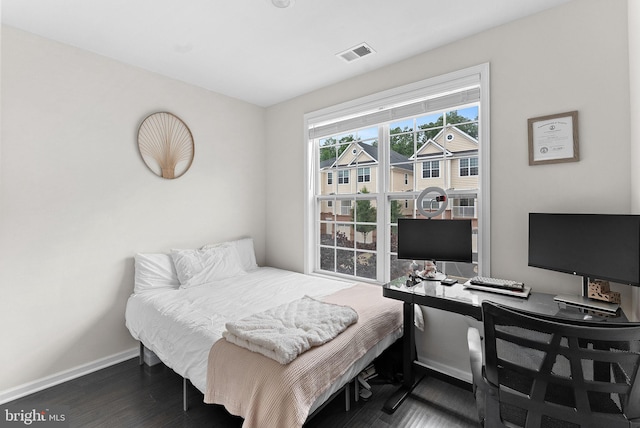 23230 Milltown Knoll Sq Unit 106, Ashburn, VA 20148 - bedroom with dark wood-style flooring and a desk