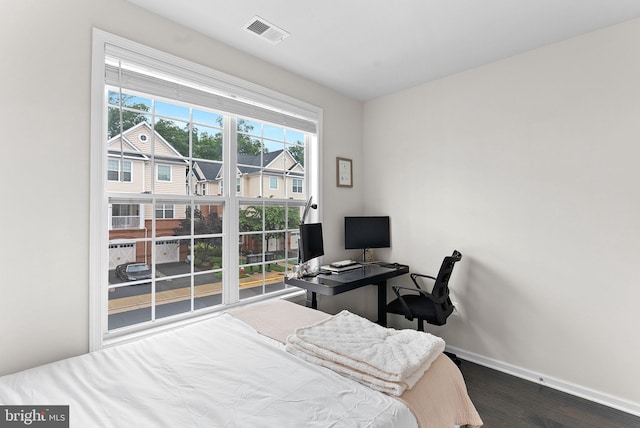 23230 Milltown Knoll Sq Unit 106, Ashburn, VA 20148 - bedroom featuring dark wood finished floors and a desk