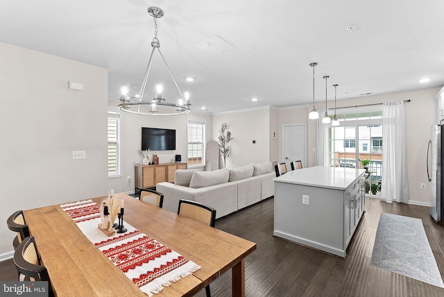 23230 Milltown Knoll Sq Unit 106, Ashburn, VA 20148 - dining area featuring a chandelier, healthy amount of natural light, dark wood-type flooring, recessed lighting, and ornamental molding