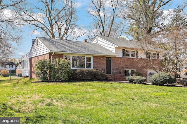 4662 Dartmoor Dr, Wilmington, DE 19803 - tri-level home featuring brick siding, roof with shingles, and a chimney