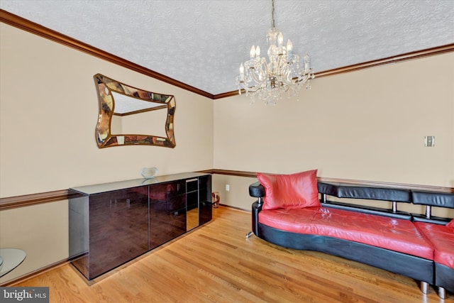 2700 Moores Valley Dr, Baltimore, MD 21209 - sitting room with a chandelier, wood finished floors, crown molding, and a textured ceiling