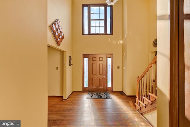2700 Moores Valley Dr, Baltimore, MD 21209 - entryway with wood finished floors, stairway, a towering ceiling, and a chandelier