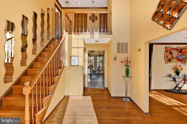 2700 Moores Valley Dr, Baltimore, MD 21209 - foyer featuring wood finished floors, stairs, and a high ceiling