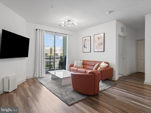 10755 Fairgrounds Dr Unit 223, Fairfax, VA 22030 - living area with wood finished floors and a chandelier