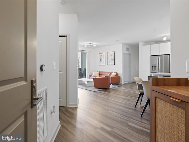 10755 Fairgrounds Dr Unit 223, Fairfax, VA 22030 - entryway featuring light wood-style flooring and baseboards