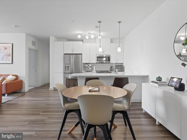 10755 Fairgrounds Dr Unit 223, Fairfax, VA 22030 - dining area with dark wood-style flooring