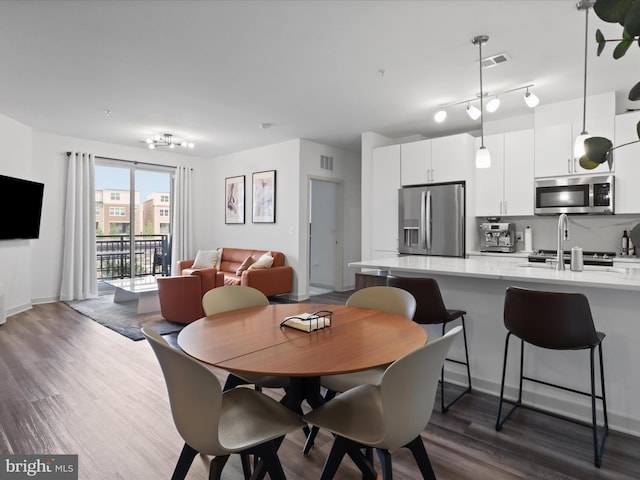 10755 Fairgrounds Dr Unit 223, Fairfax, VA 22030 - dining space with dark wood-style floors