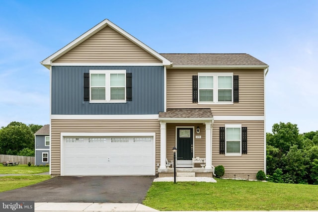 379 Eurasian Dr, Bunker Hill, WV 25413 - view of front of home featuring asphalt driveway, a garage, a front lawn, and a shingled roof