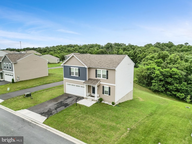 379 Eurasian Dr, Bunker Hill, WV 25413 - traditional home featuring asphalt driveway, a garage, roof with shingles, and a front yard