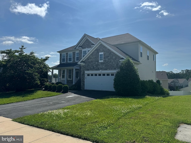 114 Renee Ln, Winchester, VA 22602 - view of front facade with asphalt driveway, stone siding, a front lawn, and an attached garage