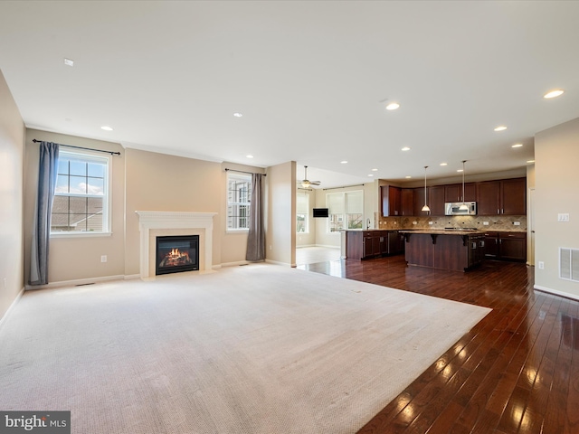 114 Renee Ln, Winchester, VA 22602 - unfurnished living room with a fireplace with flush hearth, dark wood finished floors, and recessed lighting