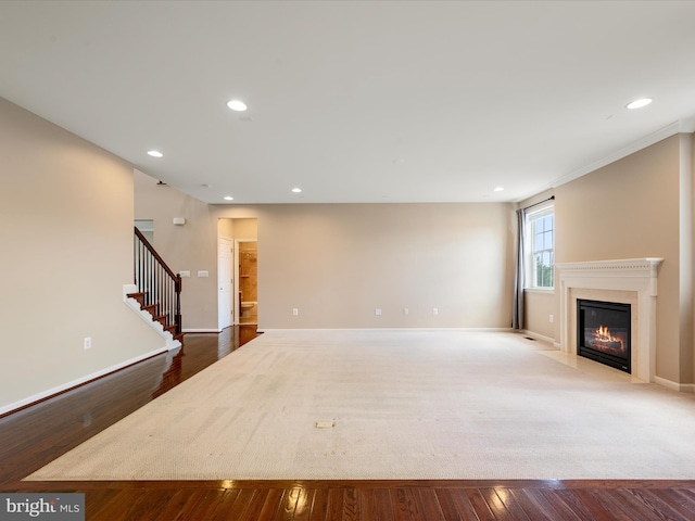 114 Renee Ln, Winchester, VA 22602 - unfurnished living room featuring a fireplace with flush hearth, recessed lighting, stairway, and wood finished floors