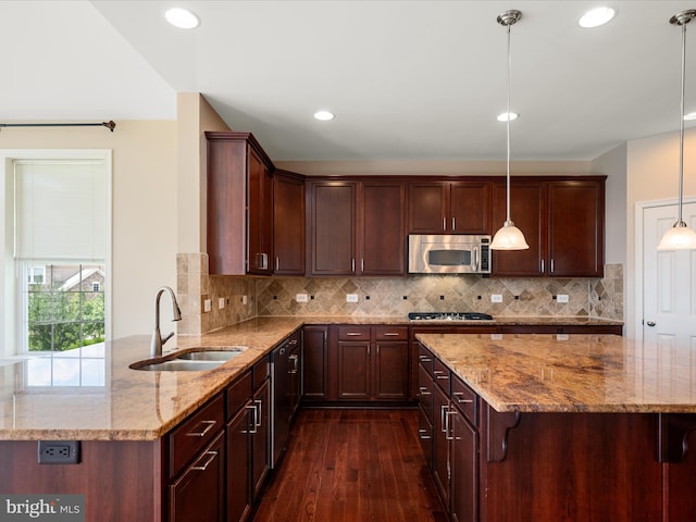 114 Renee Ln, Winchester, VA 22602 - kitchen featuring stainless steel appliances, dark wood-type flooring, light stone countertops, recessed lighting, and a peninsula