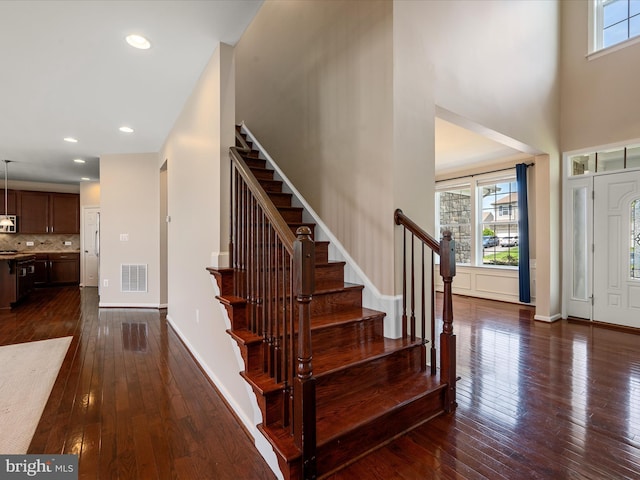 114 Renee Ln, Winchester, VA 22602 - foyer entrance featuring dark wood-style floors, stairs, a towering ceiling, and recessed lighting