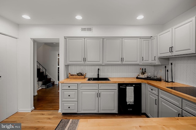 6128 Buckingham Manor Dr, Baltimore, MD 21210 - kitchen with black appliances, butcher block countertops, gray cabinetry, decorative backsplash, and light wood-style floors