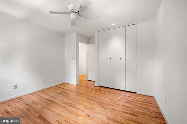 6128 Buckingham Manor Dr, Baltimore, MD 21210 - unfurnished bedroom with light wood-style flooring, a closet, and a ceiling fan